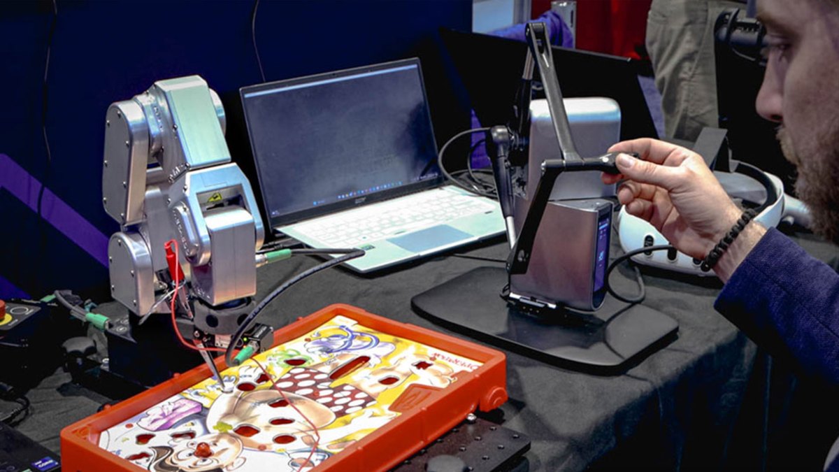 Meca500 robot controlling a precision task on a tabletop game with haptic feedback control