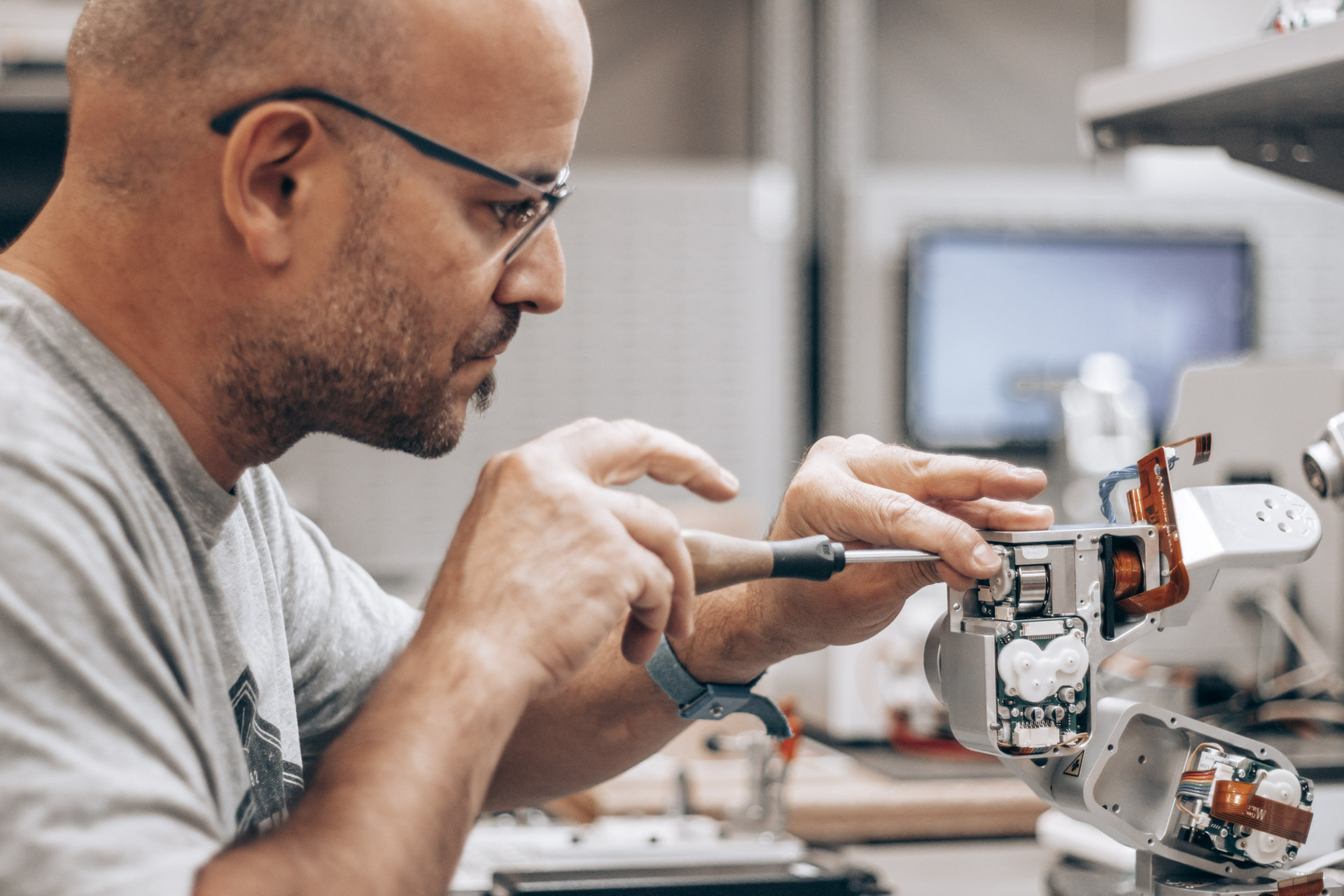 Employee performing repair tasks on a Meca500 robot